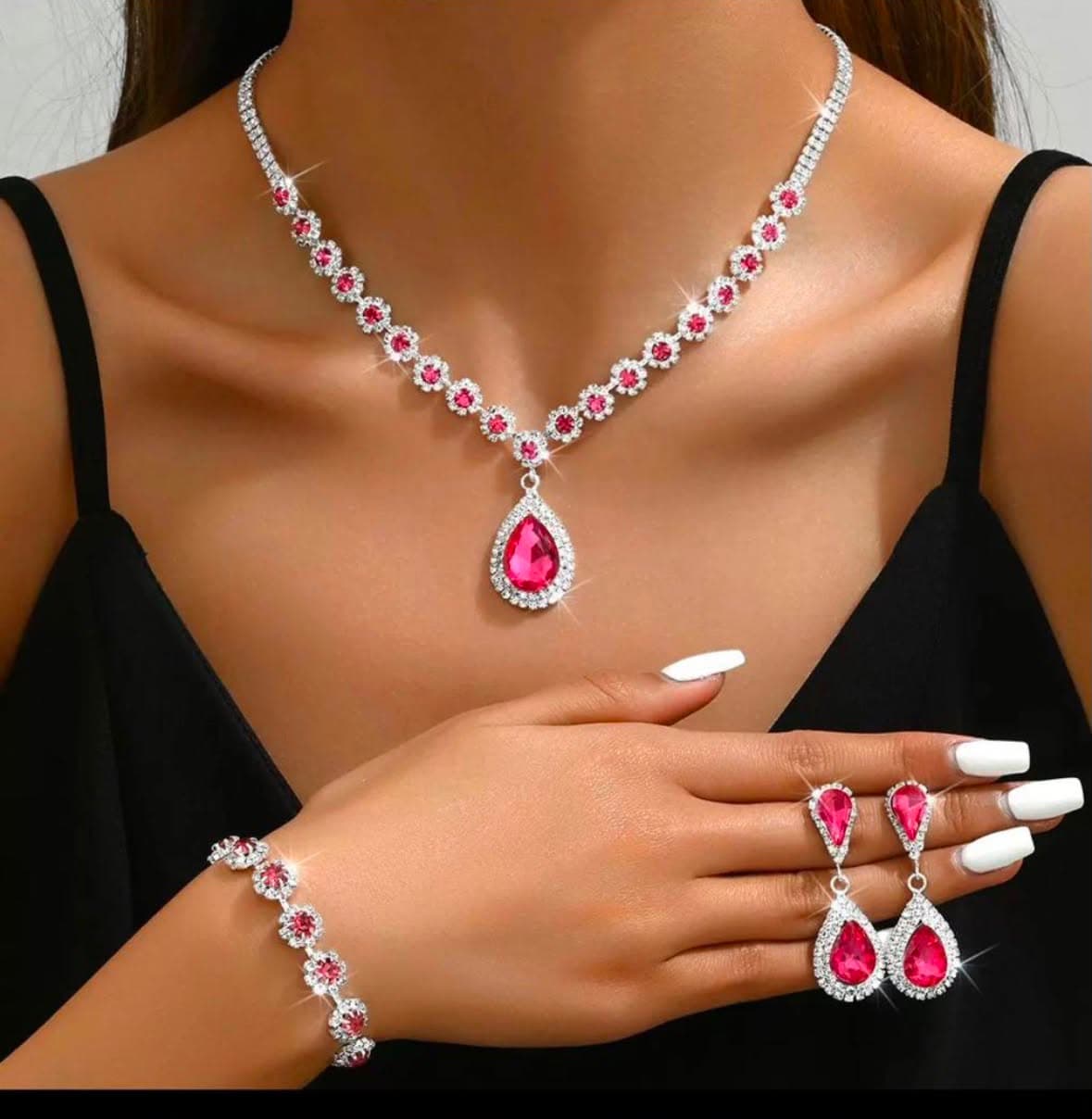Model wearing a pink crystal necklace, bracelet and earring set